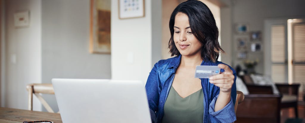 Young woman work from home on her laptop.