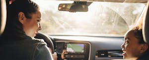 mercury-auto-insurance-review1129803108 Smiling woman in car with young daughter