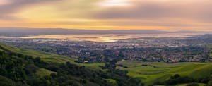 fremont-debt-statistics Sunset view of Fremont, California, from high up on a green hill