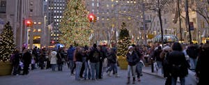 A city street crowded with holiday shoppers.