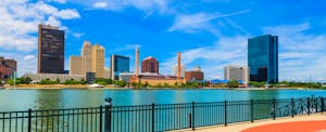 toledo-debt-statistics Skyline view of downtown Toledo, riverwalk and river in foreground